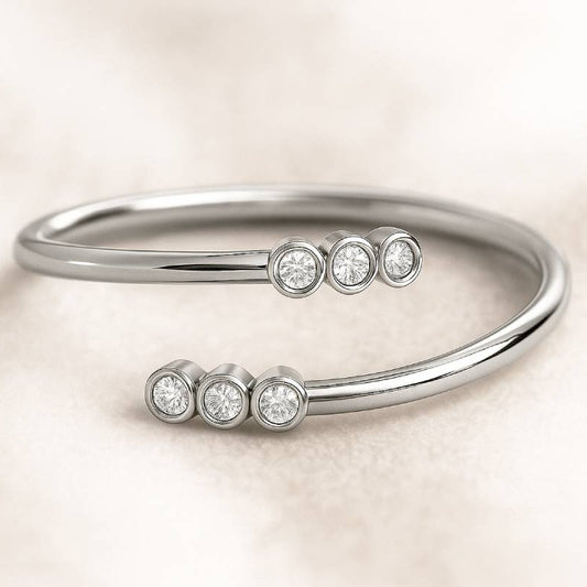Silver bracelet with diamond-like stones on a beige background