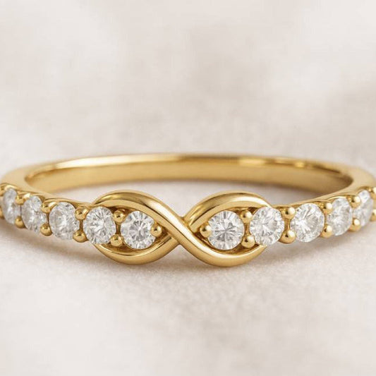 Gold ring with diamonds on a beige background