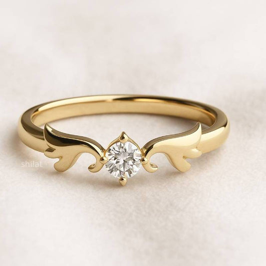 Gold ring with a diamond on a light beige background