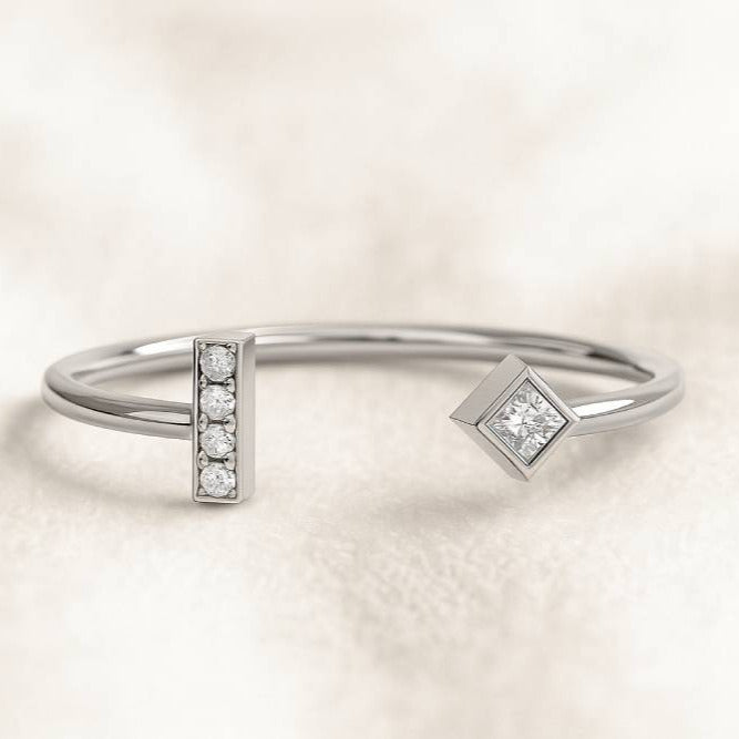 ring with diamond accents on a light beige background