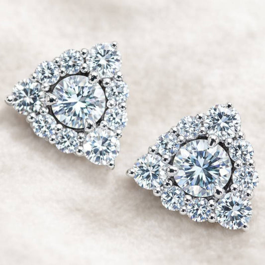 Pair of diamond earrings on a light background