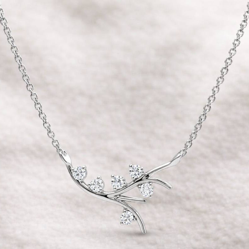 necklace with diamond branch design on a light background