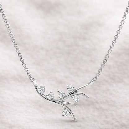 necklace with diamond branch design on a light background