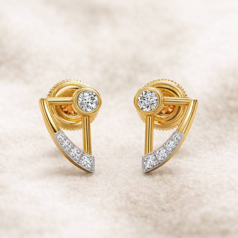 Gold earrings with diamond accents on a beige background