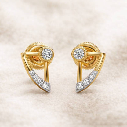 Gold earrings with diamond accents on a beige background