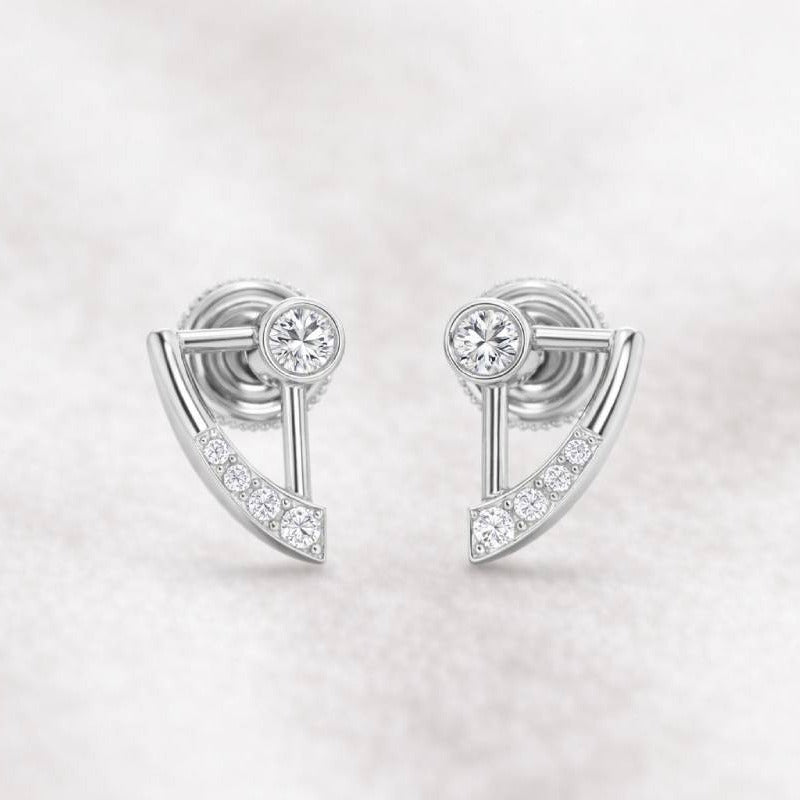 Pair of earrings with gemstones on a light gray background