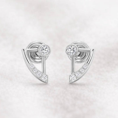 Pair of earrings with gemstones on a light gray background