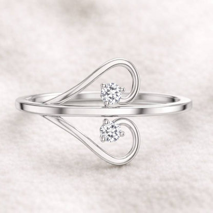  ring with two diamonds on a light background