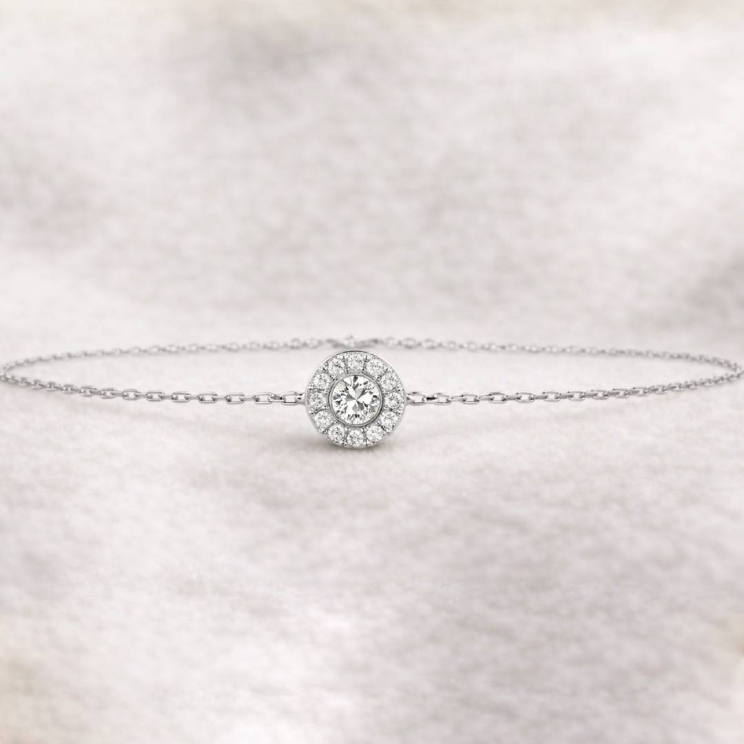 bracelet with a round diamond charm on a light fabric background