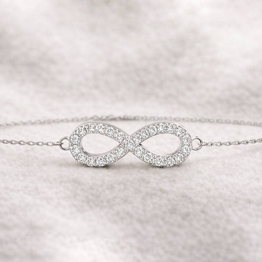 infinity bracelet on a light gray background