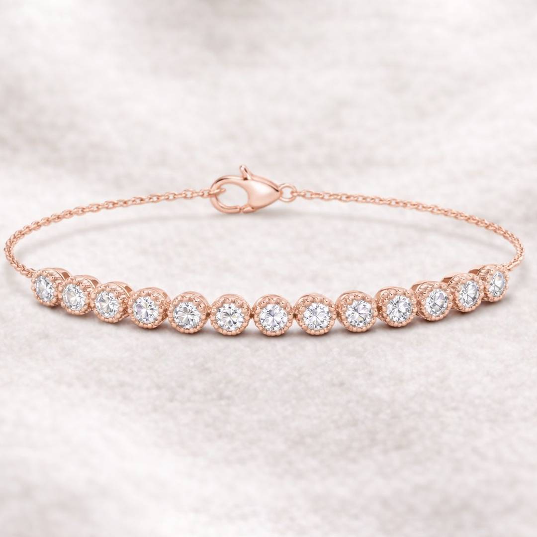 Rose gold bracelet with clear gemstones on a light pink background