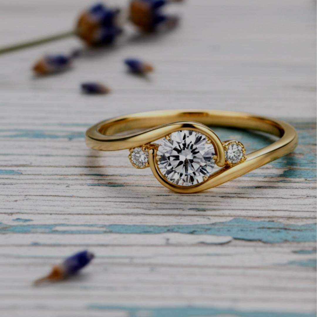 Gold ring with a diamond on a textured surface