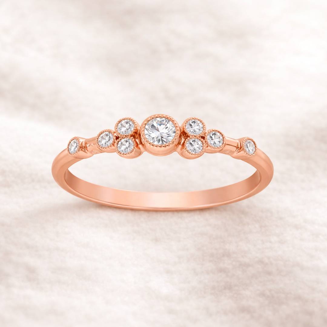Rose gold ring with diamonds on a soft beige background