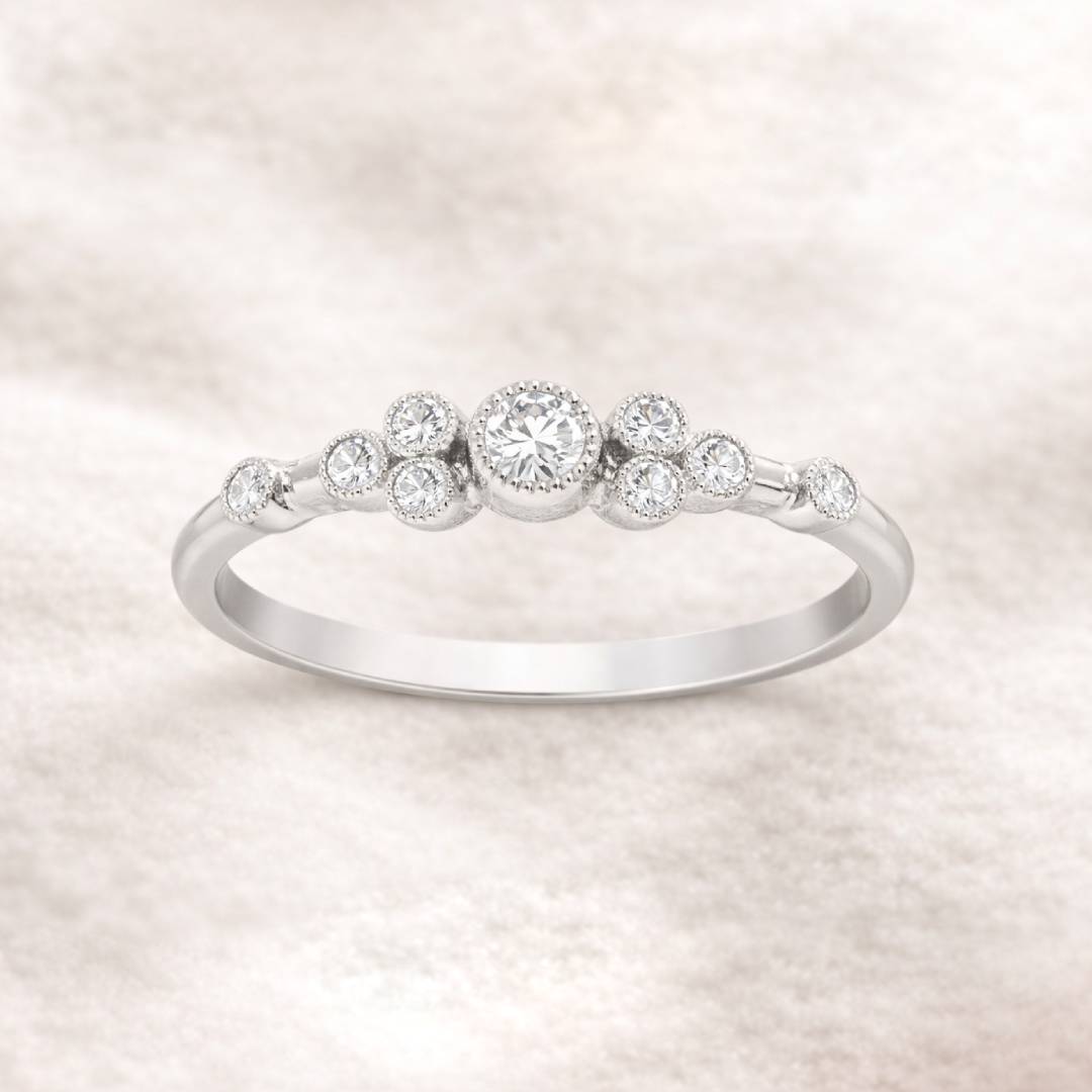  ring with small diamonds on a light background