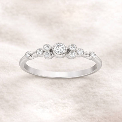  ring with small diamonds on a light background