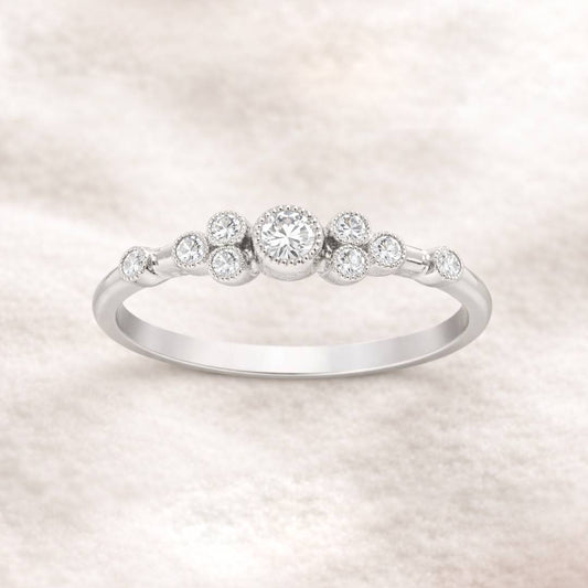  ring with small diamonds on a light background