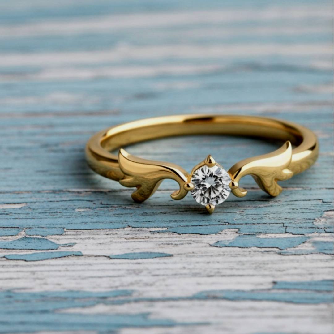 Gold ring with a diamond on a textured blue surface
