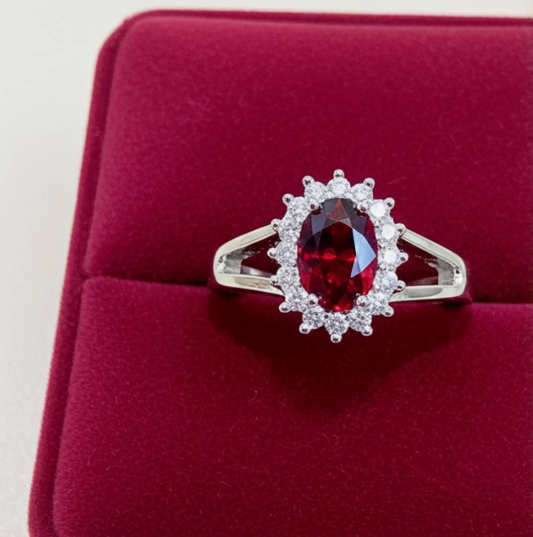 Ring with a red gemstone on a red cushion