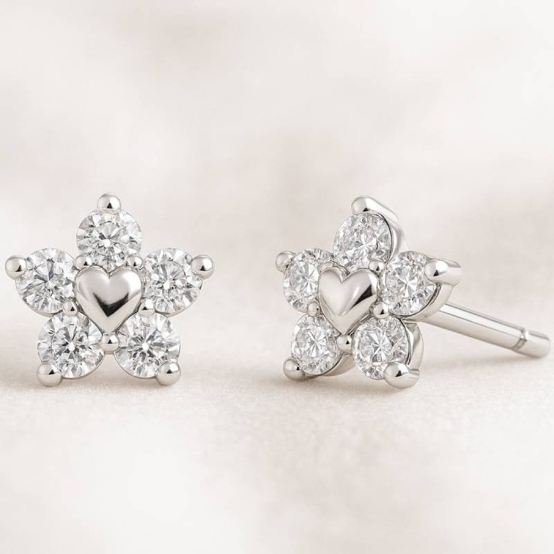 earrings with heart designs on a light background