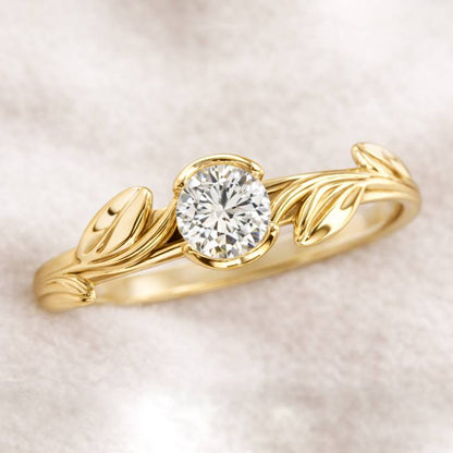Gold ring with a diamond on a soft beige background