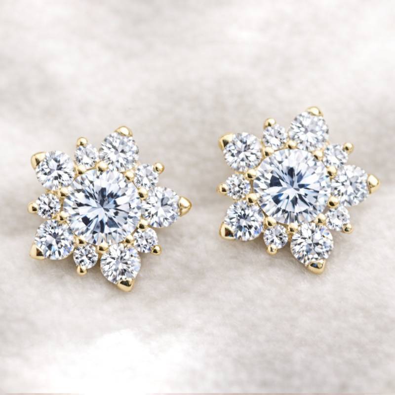 Pair of diamond earrings on a light background