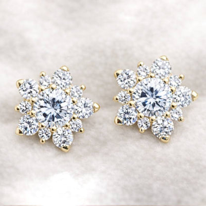 Pair of diamond earrings on a light background
