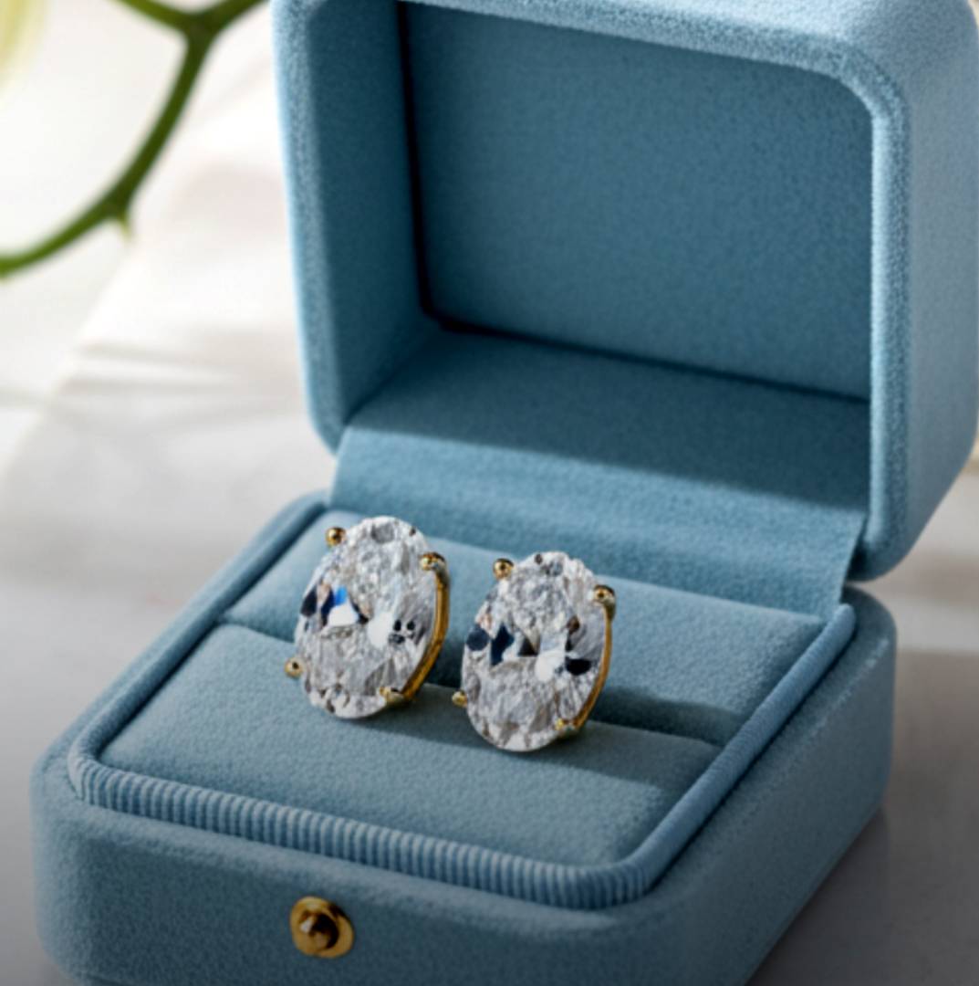 Pair of diamond earrings in a blue jewelry box