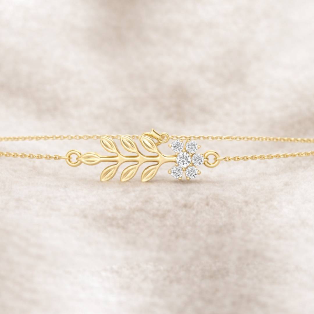 Gold bracelet with floral design on a beige fabric background