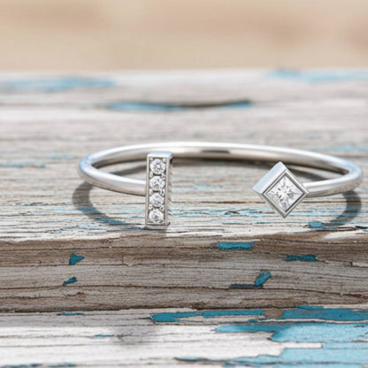 ring with diamond accents on a wooden surface