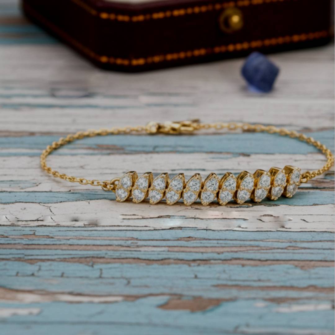 Gold bracelet with diamonds on a wooden surface