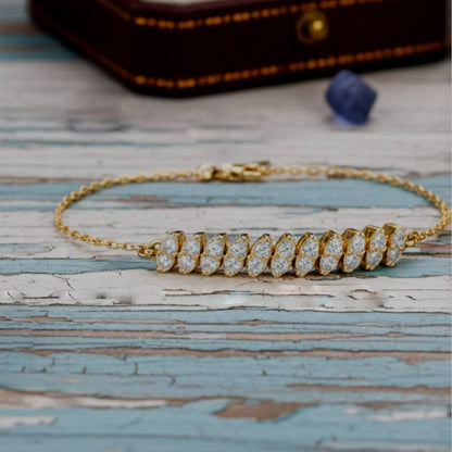 Gold bracelet with diamonds on a wooden surface