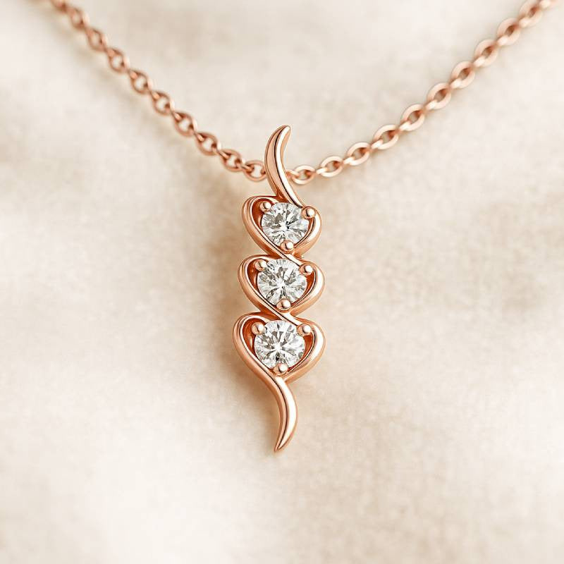Rose gold necklace with a heart-shaped pendant on a beige background