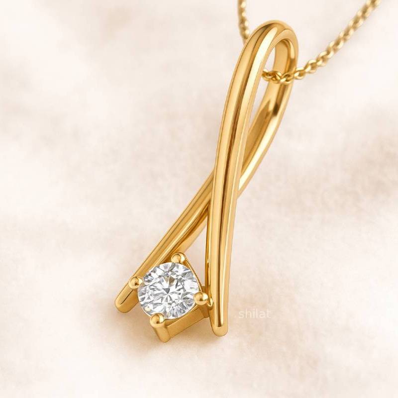 Gold necklace with a diamond pendant on a soft beige background