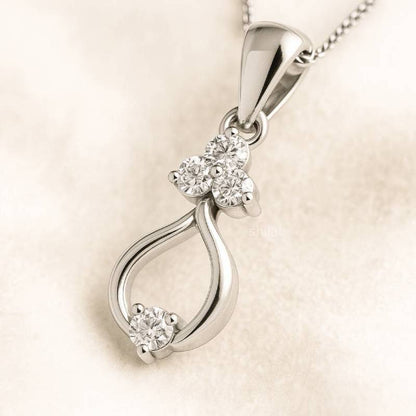  pendant with diamond accents on a beige background