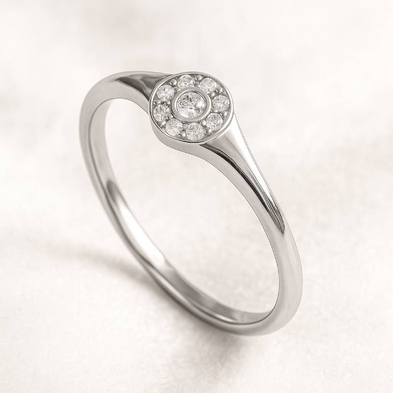  ring with a small diamond on a light gray background