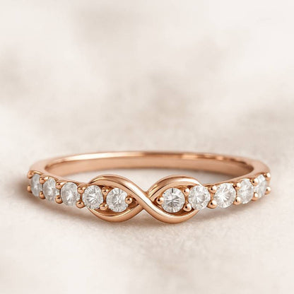 Rose gold ring with diamonds on a beige background