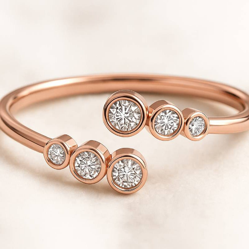 Rose gold ring with diamonds on a light background