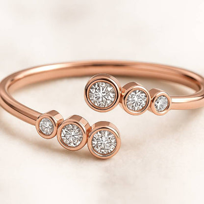 Rose gold ring with diamonds on a light background