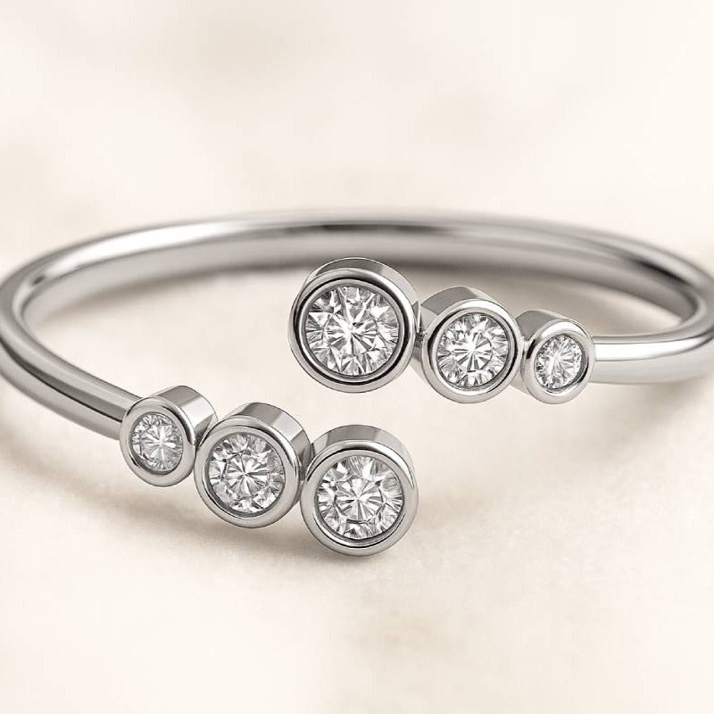 ring with diamond-like stones on a light beige background