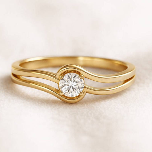 Gold ring with a diamond on a light beige background