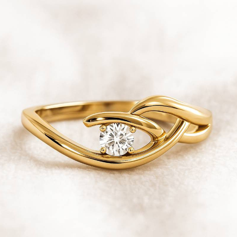 Gold ring with a diamond on a soft beige background