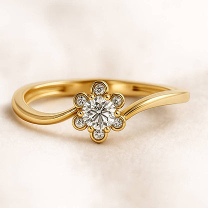 Gold ring with a diamond on a beige background