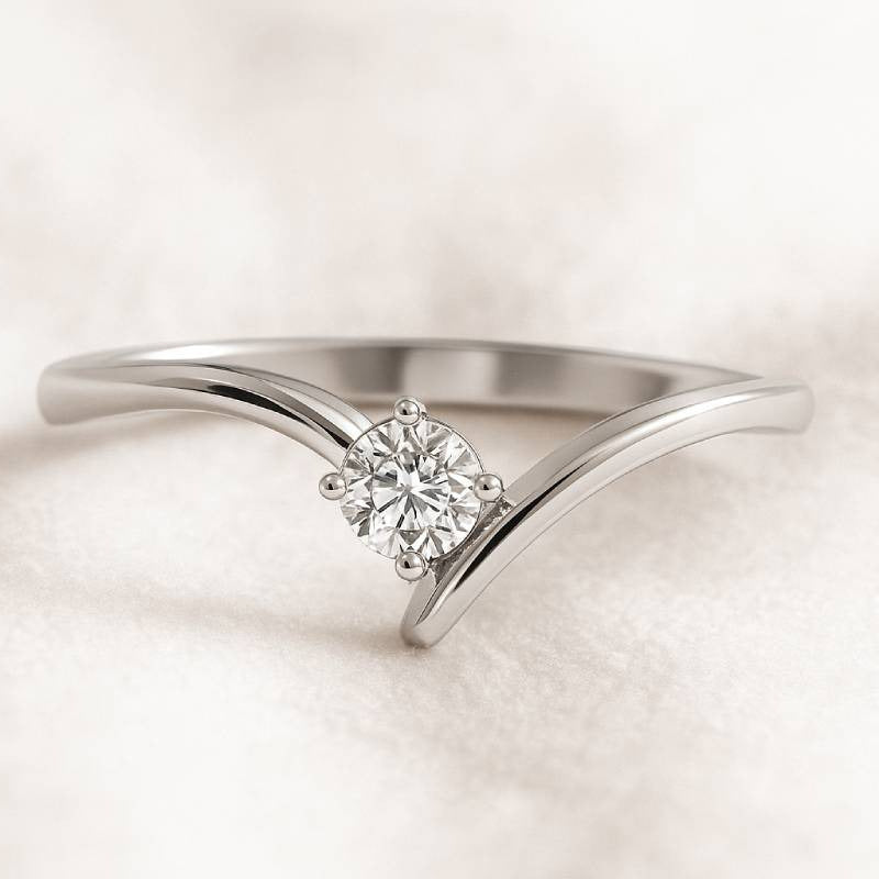 ring with a diamond on a light beige background