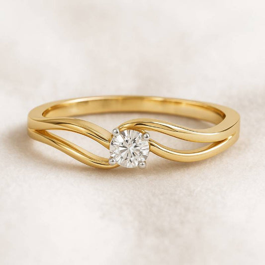 Gold ring with a diamond on a beige background