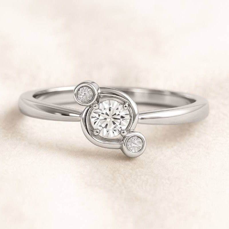 ring with a central diamond and smaller diamonds on a beige background