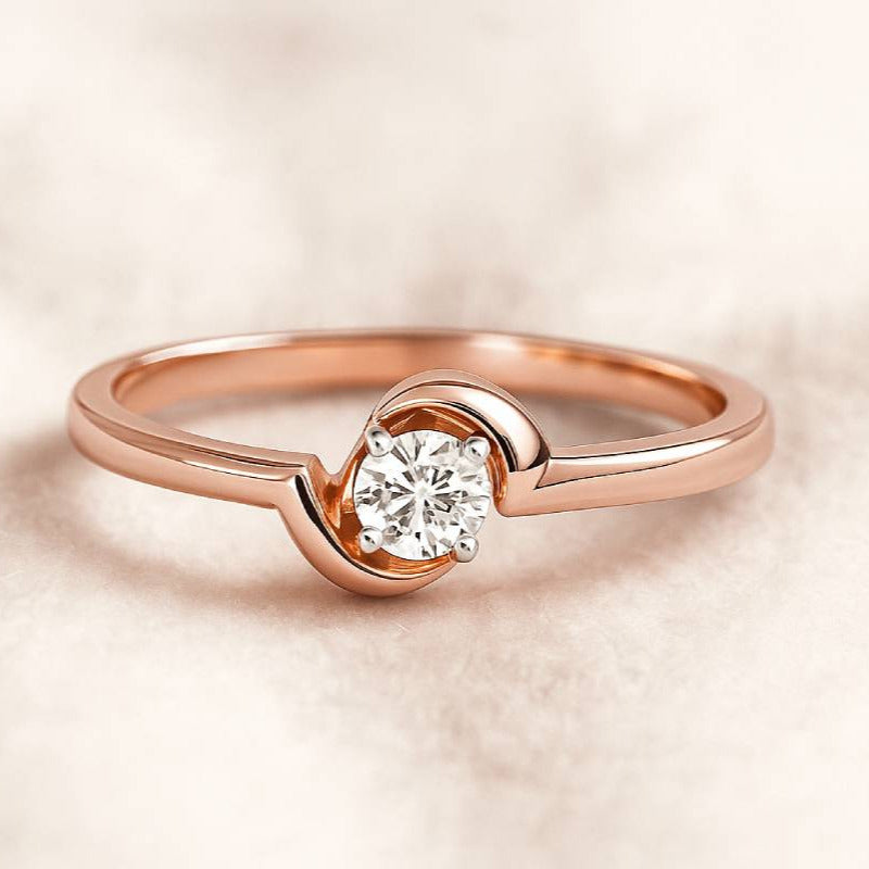 Rose gold ring with a diamond on a soft beige background