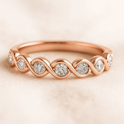 Rose gold ring with diamonds on a beige background