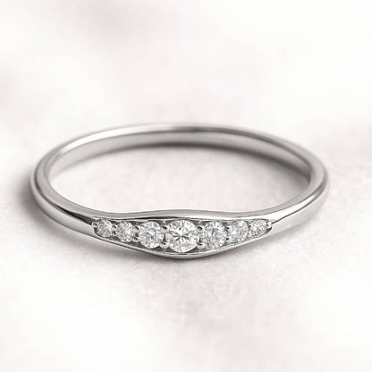 ring with small diamonds on a light background