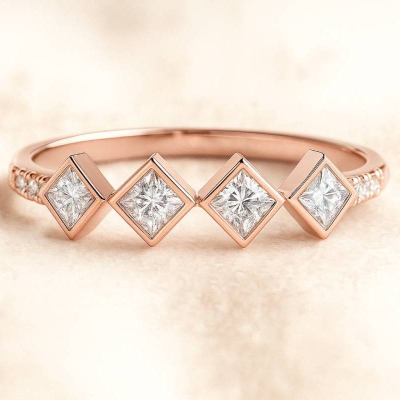 Rose gold ring with square-cut diamonds on a soft beige background