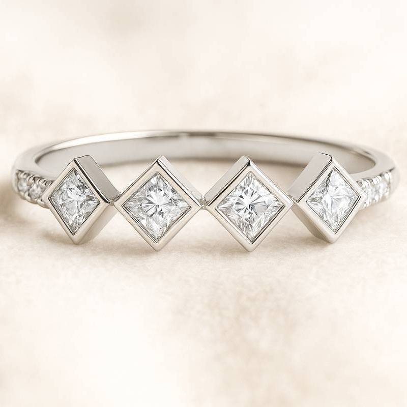  ring with square-cut diamonds on a light background